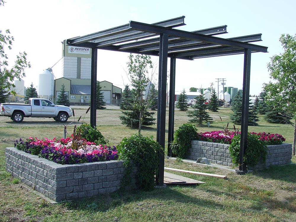 Rail Arbor/Pergola with flower beds (August 2014).